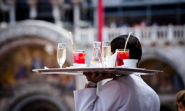 Hospitality staff happier at work despite pay squeeze, survey finds